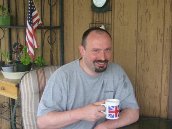 K-1 Fiancé Visa process: Relaxing on my porch with a union jack mug of coffee and the stars and stripes in the background.
