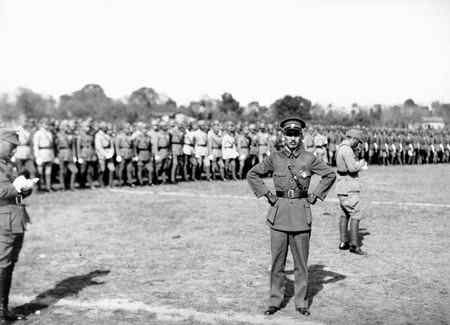 Photo taken in 1933. Chiang Kai-shek in a military parade honoring him for suppressing the People's Revolutionary Government of the Republic of China in Fujian. History discussed in Eyes of Emerald.