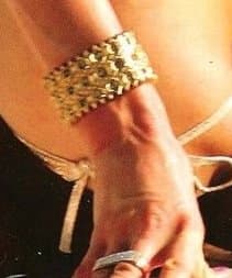 Royal jewelry while wearing a bikini? Paris Hilton says yes, in style. Check out the large golden bracelet.