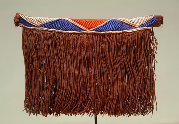Pedi Apron which is worn as front panels called "Gabi". These aprons are mede from leather, plant fiber and glass beads