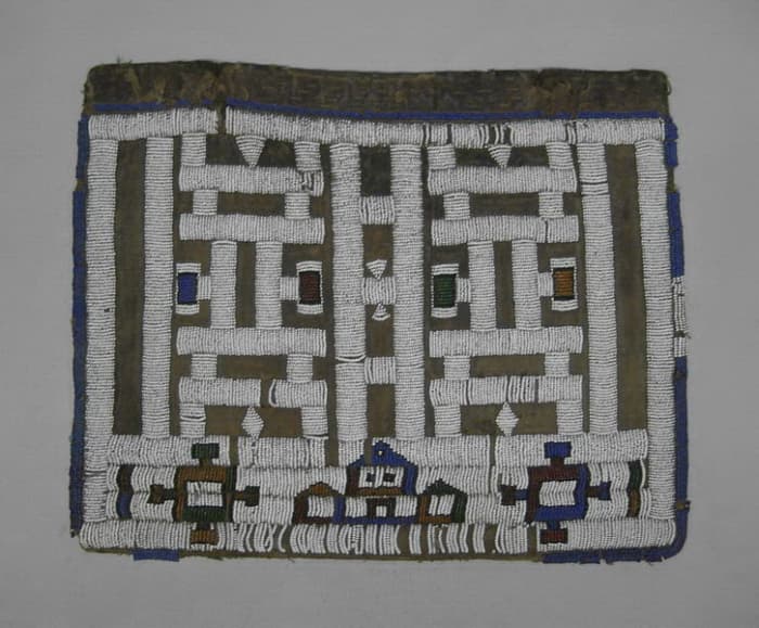 Ndebele Apron called "Pepetu", which a small beaded apron worn by a young ndebele maiden after completing a period of seclusion. These ries represent female initiation