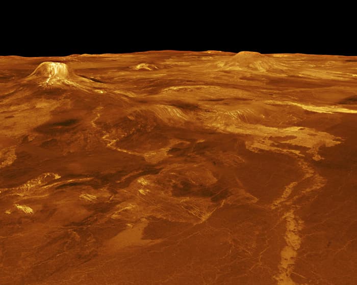 Lava flows extend for hundreds of kilometres across fractured plains in front of the volcano Gula Mons, (top left) in western Eistla Regio. The radar image is taken 1,100 km (700 miles) NE of Gula Mons at an elevation of 7.5 km (4.6 miles)