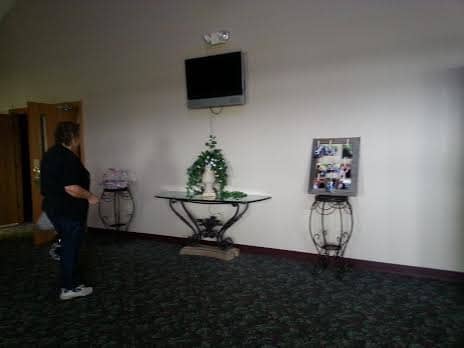 Many church foyers have screens in the foyer where you can view the service while quieting a chatty or crying child.
