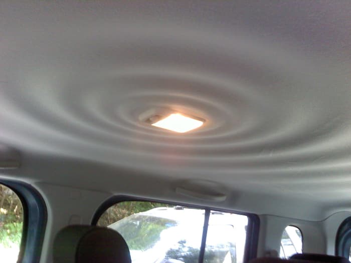 I would assume that the "ripples in water" pattern on the interior ceiling is supposed to exude a feeling of inner calm ... or something.