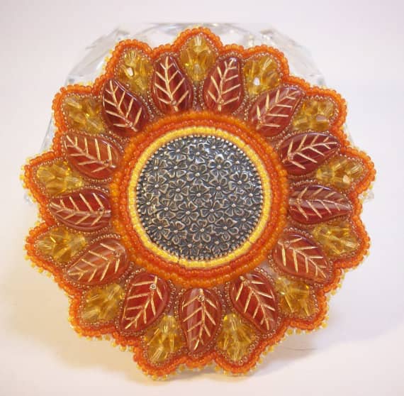 This is actually example of bead embroidery. You can still create stunning pieces without using the bead holes.