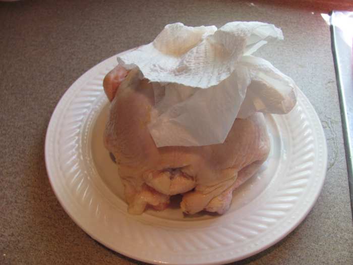 Make sure you wash and pat dry the inside and outside of chicken. Remove giblets inside of chicken, if any.