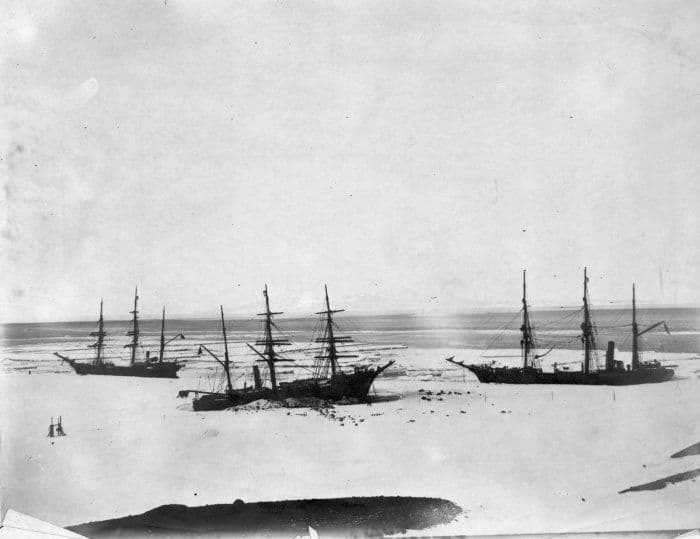 Discovery (centre) trapped by the ice in McMurdo Sound, accompanied by Morning (left) and Terra Nova (right) in February, 1904.