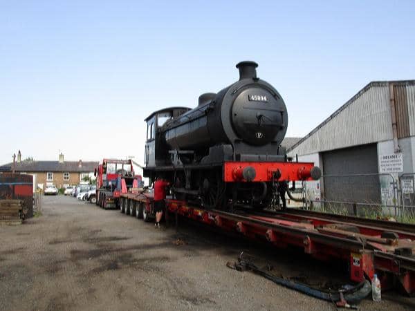 From the front buffer beam end, 65894 is inched slowly down the ramp to be rejoined with her tender