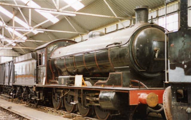 63395 on display with an information board on her running plate awaits overhaul work at NELPG's shed near Deviation Shed, Grosmont, 1994 (R Pearson)
