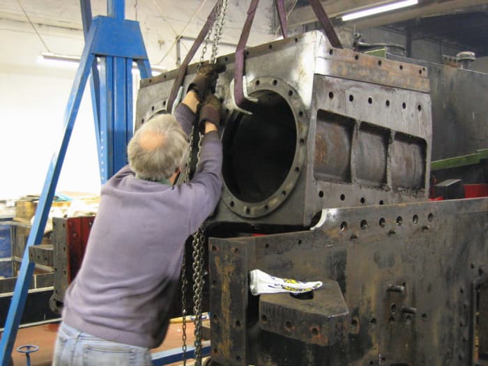 A fracture in the cylinder block was the main reason for work needed, with other jobs arising. Here the cylinder block is lifted from the frames