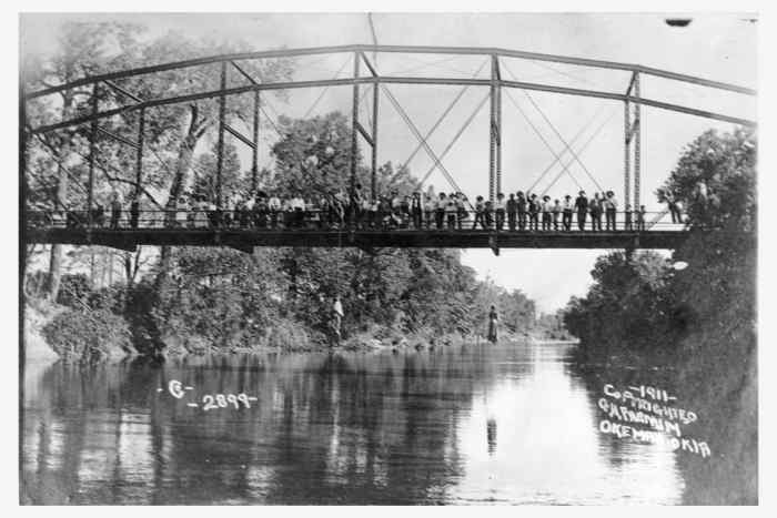 The lynching of Laura Nelson and her son, L.D. Nelson. Either Laura or L.D. killed a sheriff's deputy; they were taken from the county jail and lynched. Laura's baby, Carrie, lay on the river bank while her mother and brother were lynched.