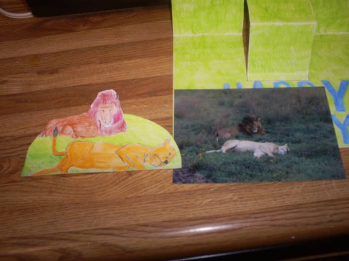 I cut out the image of the lions after I was finished drawing/coloring. The lions look as if they are on a mound, which will make this image stand out even more on the pop-up card.