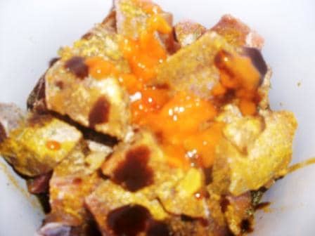 goat meat in slow cooker with curry powder, hot pepper sauce, jerk sauce and other spices. Stir well, adding 1/4 cup water
