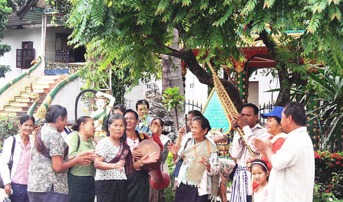 As a tradition, crowds of people will gather during a celebration to raise donation money for their wat or temple. Courtesy of flickr.com