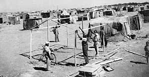 Squatters seen here erecting their ramshackle shack house which Mpanza found deplorable and went out to fight against