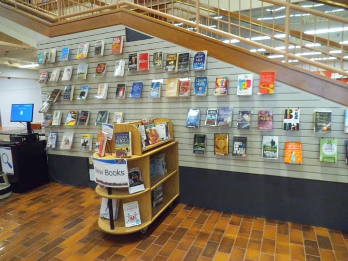 The Saint John Public Library in New Brunswick, Canada has a wall for displaying books and a freestanding unit too.