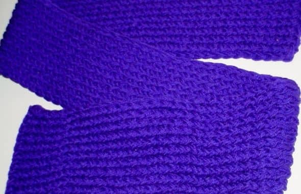 Purple scarf done with the figure 8 wrap on the pink Knifty Knitter loom. TWO strands of Red Heart Super Saver yarn were used to make a denser, heavier scarf.