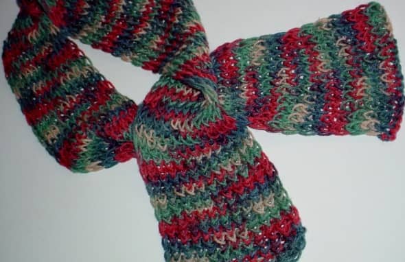 Multi-color scarf done with the figure 8 wrap on the pink Knifty Knitter loom. One strand of Red Heart Super Saver yarn was used. (This is identical to the blue scarf above, it is simply done with a multi-color yarn.)