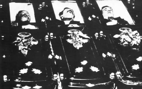 Tom MacLaurie, Frank MacLaurie and Billy Clanton displayed in the Tombstone Funeral Parlor after the gunfight. A sign posted close to the open caskets declared, "Murdered on the Streets of Tombstone, October 26, 1881."