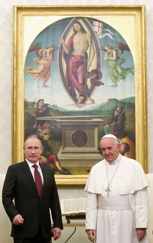Vladimir Putin and Pope Francis, both standing in front of Jesus Christ holding a flag like England, the mark of Dan.
