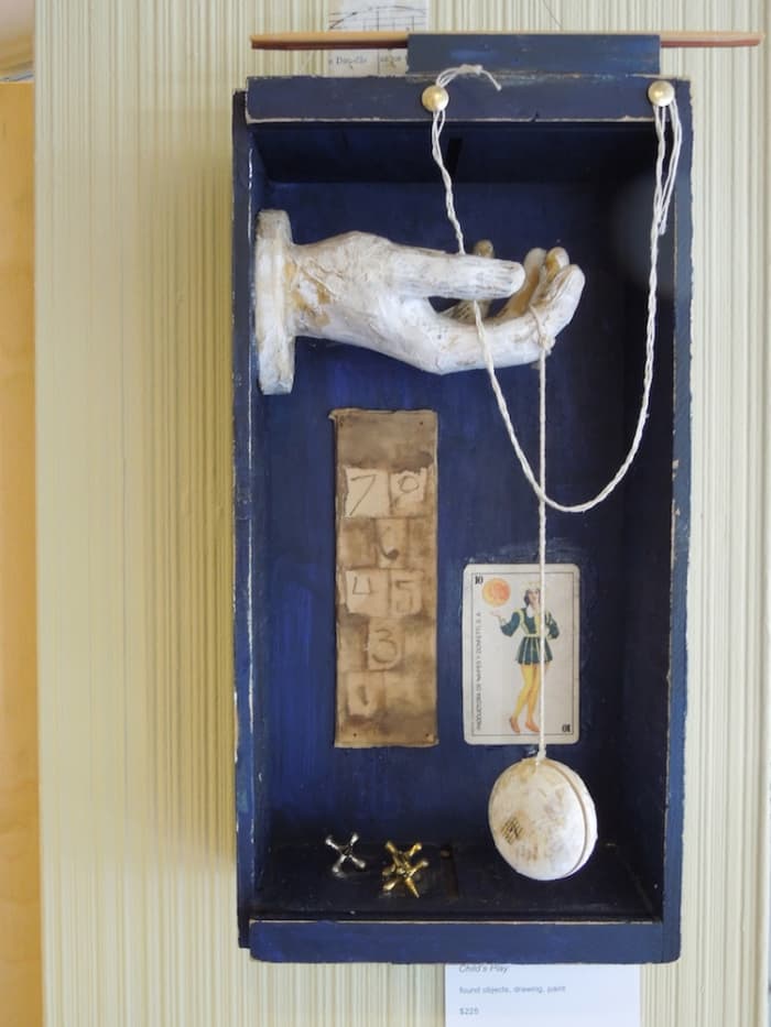 "Child's Play" by Peg Grady, made with found objects, drawings, and paint