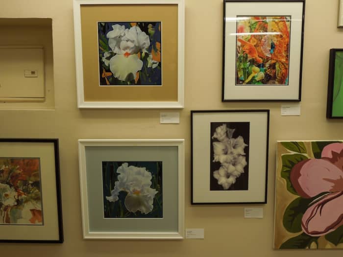 This wall of art was a bouquet of floral pictures. Where I have the name of the artists, they are in the text to the left.