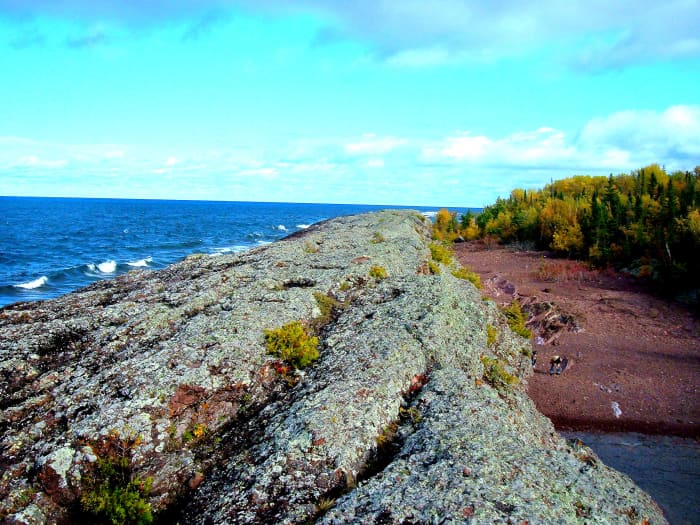 a long strip of upthrust rock running along the Lake Superior shore line in Michigan's Keweenaw Peninsula