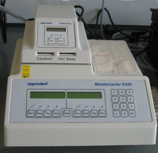 A PCR thermocycler, used to control the temperature cycles for amplifying DNA sequences.