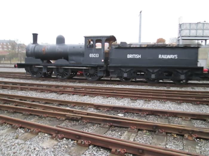 Out in the yard, the Class C 0-6-0 (LNER/BR J21) 65033 in early BR black awaits restoration in the workshop. This engine has been operating passenger trains at Beamish Open Air Museum up the road near Durham