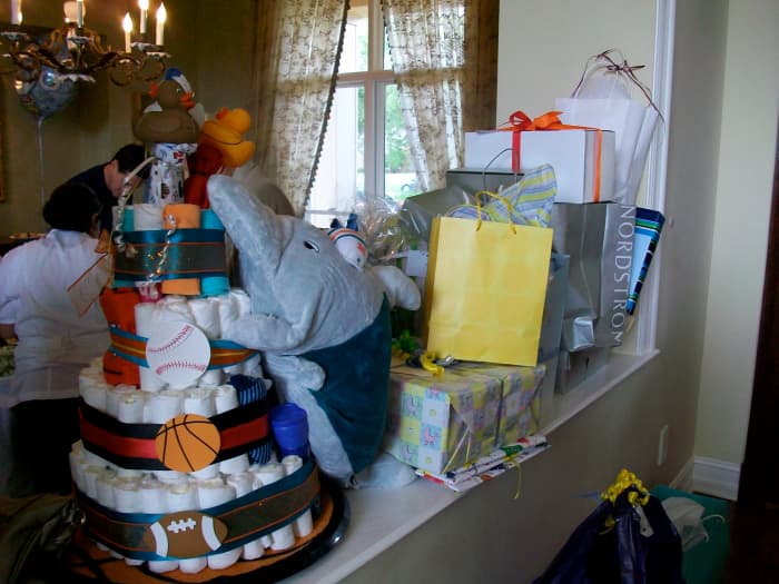 A pile of presents at a bris (brit milah). Because traditional Jews do not have baby showers, the mom's friends made a diaper cake for this occasion, instead.