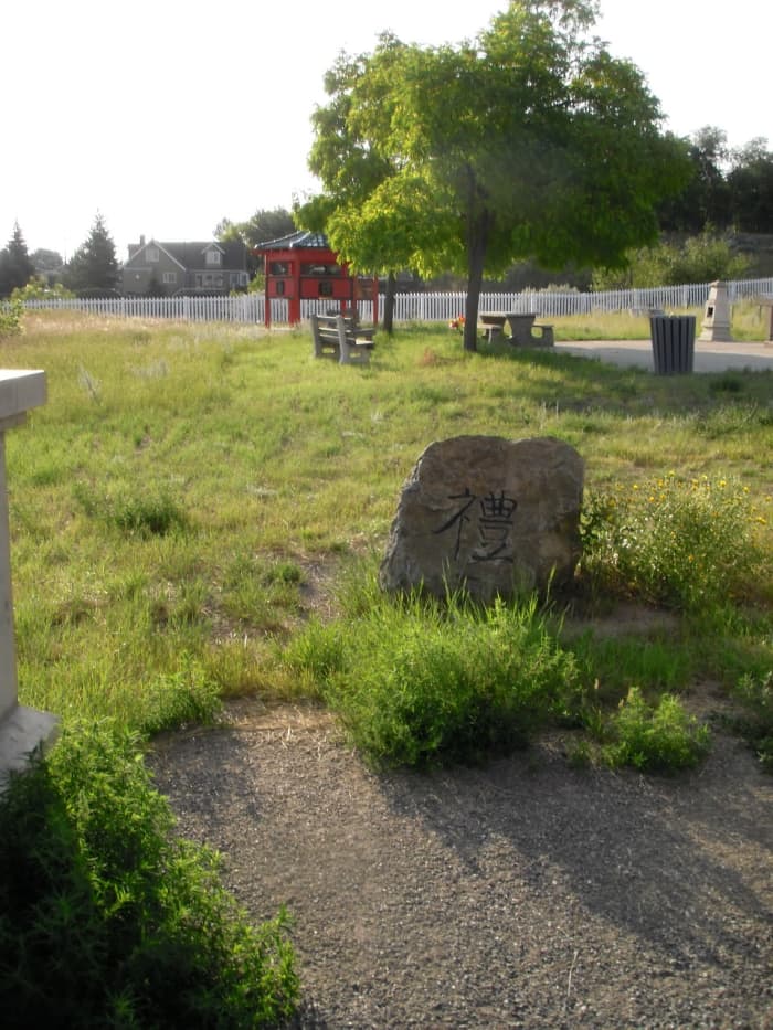 The stone at the doorway deflects the energy of the dead back into the cemetery, blocking it from mixing with the living.