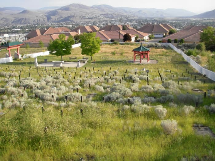 In keeping with Feng Shui geomancy, the cemetery is on high ground, facing water, and catching the wind that blows down the North Thompson River Valley from the Monashee Mountains in Wells Gray Park.