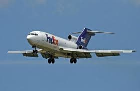 (Note: a FedEx Boeing 727 on approach with leading edge slats and wing flaps extended)