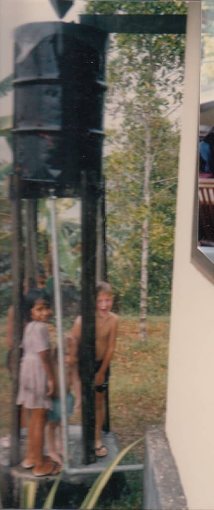 My son “showering” with the girl next door when a heavy rain caused overflow spillage from the 55-gallon drum.
