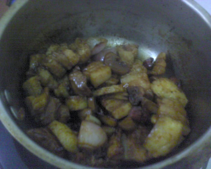 Add in the marinated pork belly after sauteing the garlic, ginger and onion.