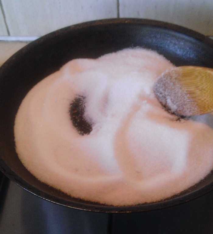 Starting to caramelise sugar. Keep it on low heat and stir slowly. 