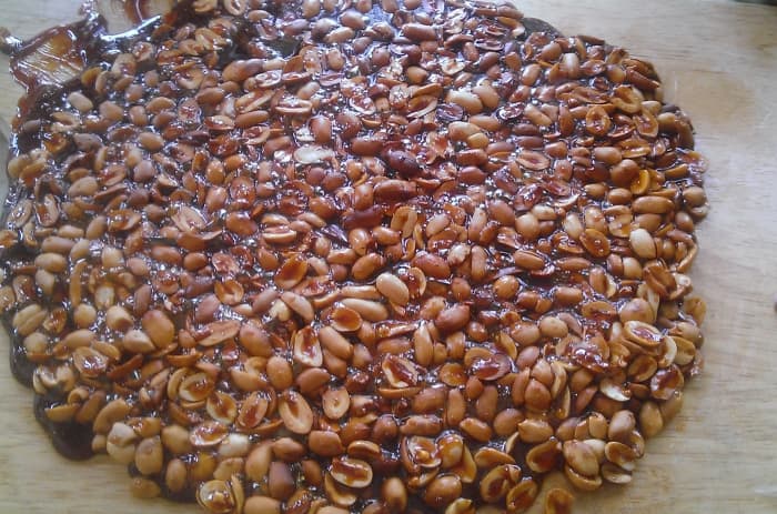 Peanut brittle mixture evenly spread out on the cutting board and left to cool for 1-2 hours. Don't forget the cooking spray before.