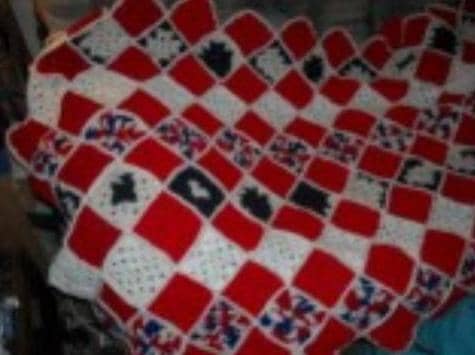 Granny Square Throws have been used for generations. Like this one using up scrapes of yarn left over from other projects creating a Red, White, and Blue beautiful throw.
