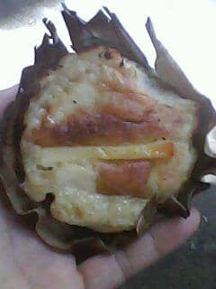 Bibingka, rice cake with slivered salted or freshly boiled eggs and ,usually prepared in a charcoal oven