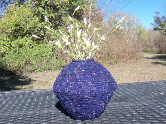 Using fabric to add vibrant splashes of color makes Sherrill's corded pottery creations stand out, no matter where they're placed.