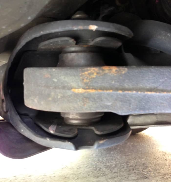 Lower-control arm bushings take a wallop on most cars. They're a major joint of a car's suspension. Check for visible wear, like cracks.