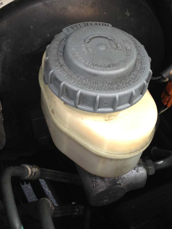 Brake fluid reservoirs are usually located at the back of the engine-bay, on the driver-side.