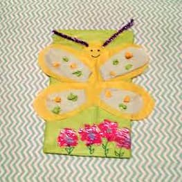 My daughter likes butterflies so I helped her make this one using the back of an oatmeal box, tissue paper and pipe cleaners for the antenna. She wanted to paint flowers at the bottom, giving it a true Spring feeling!