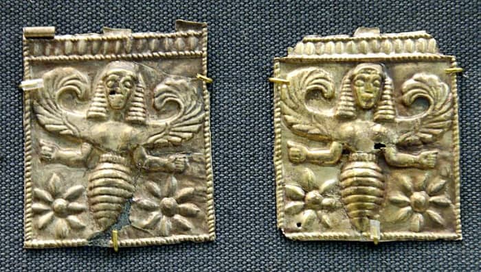 Bee-goddess, perhaps associated with Artemis above female heads. Gold plaques, 7th century BC; British Museum