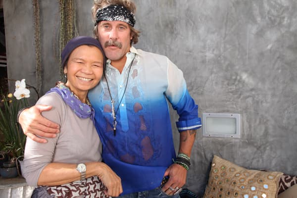 Two bright smiling faces doning the famous wrap leather bracelets made by Chan Luu (Chan Luu left and Donavon Frankenreiter right)