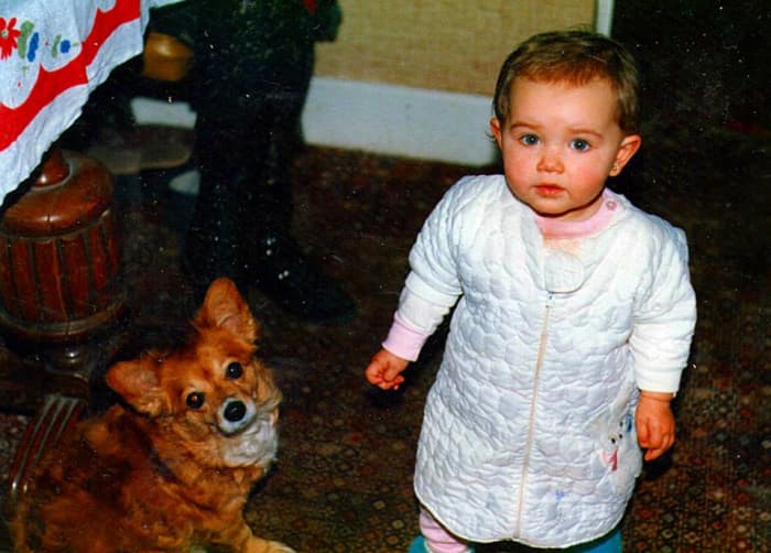 Andy and Mitch's daughter, Jade, in my parents' kitchen, with my dog, Susie, who always hung out with us when any friends came round
