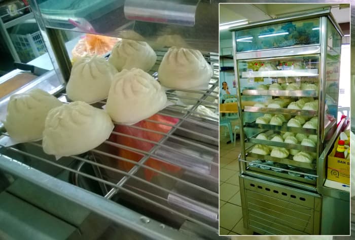 A stainless steel tired steamer for Chinese Tim Sum of pork, seafood, vegetable, beans dumplings and glutinous rice. Beneath the trays is a container which holds the boiling water.