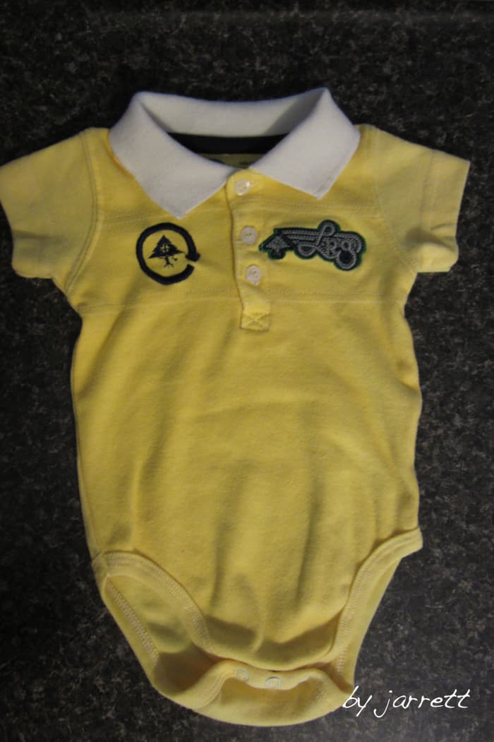 Dyed the polo yellow. I wasn't concerned about the logos because other pieces of the costume would cover them up.