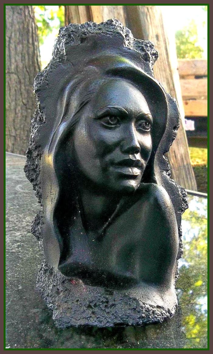 She is about 5 1/2 inches tall. Pretty cameo type sculpt of a woman. Marked on the bottom LOKE Rose Made with Lava Co Co Joe 64 Hawaii. Pretty heavy lava sculpture a little over a pound.