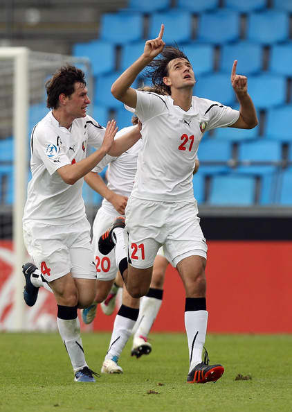 Siarhiej Palitsevich (4) celebrates with Yahor Filipenko (21) in Belarus's match against the Czech Republic on June 24, 2011. Filipenko scored the winning goal to send the Czech Republic to the 2012 Summer Olympics.